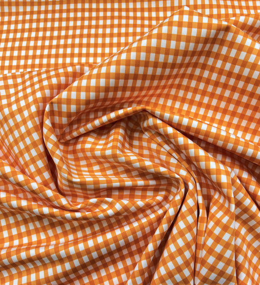 Cotone elasticizzato quadretti arancioni su sfondo bianco