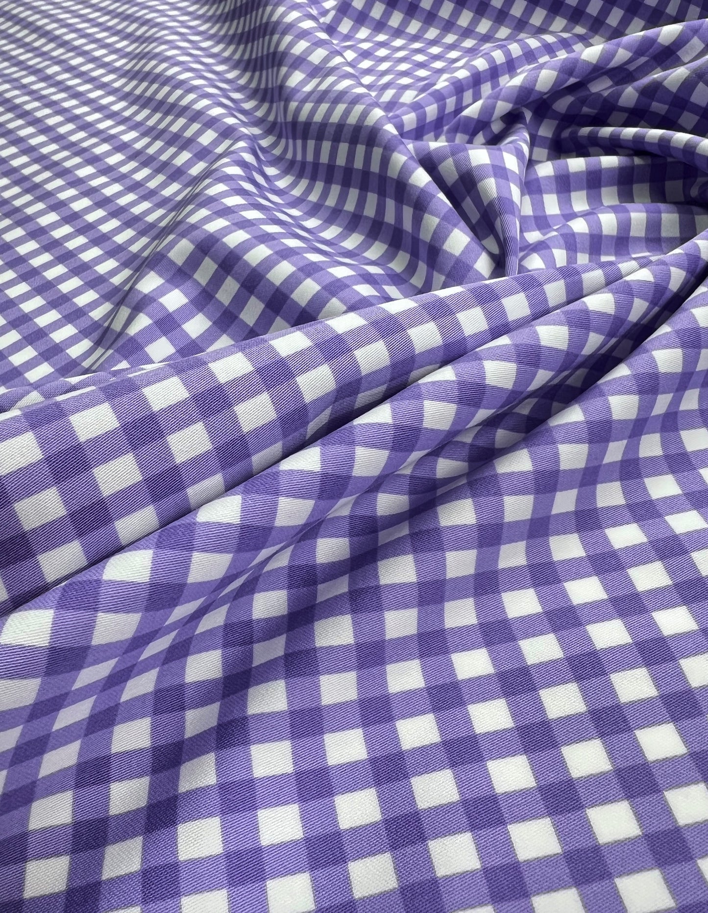 Cotone elasticizzato quadretti viola su sfondo bianco