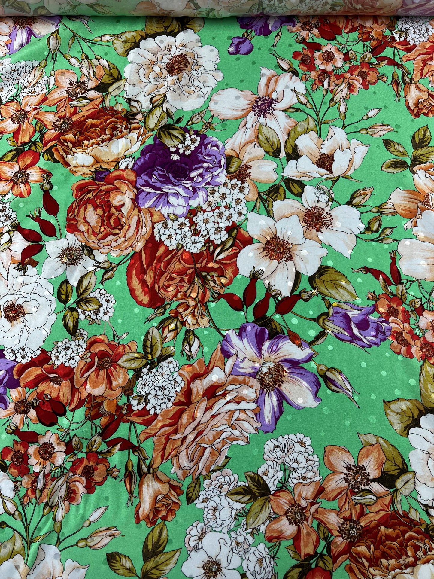 Jacquard di seta verde a pois