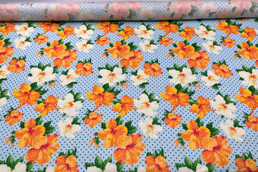 Lino stampato fiori arancioni su sfondo azzurro