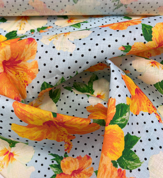 Lino stampato fiori arancioni su sfondo azzurro